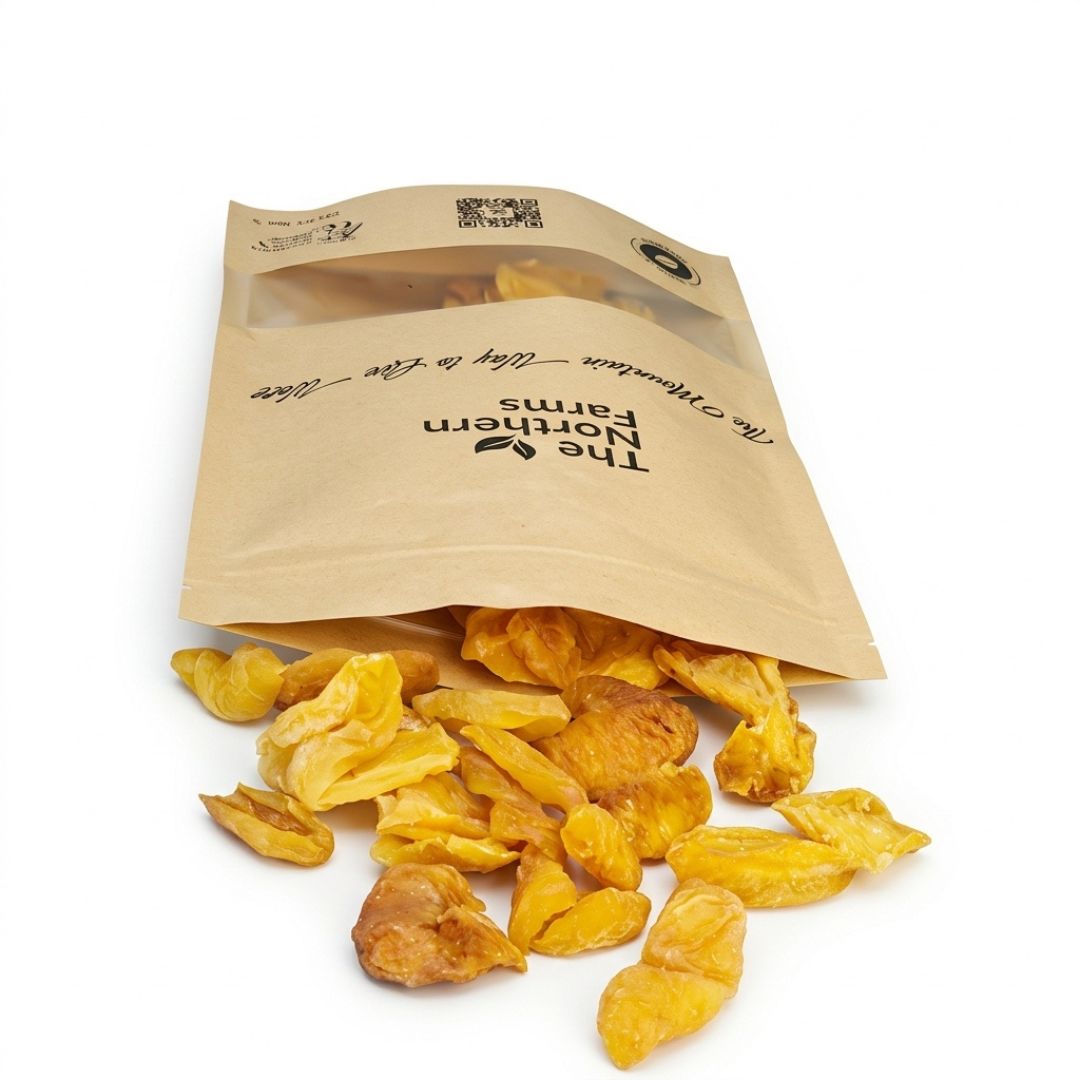 Crunchy sun-dried white apricots spilling out of a pouch by The Northern Farms organic Chitral khubani
